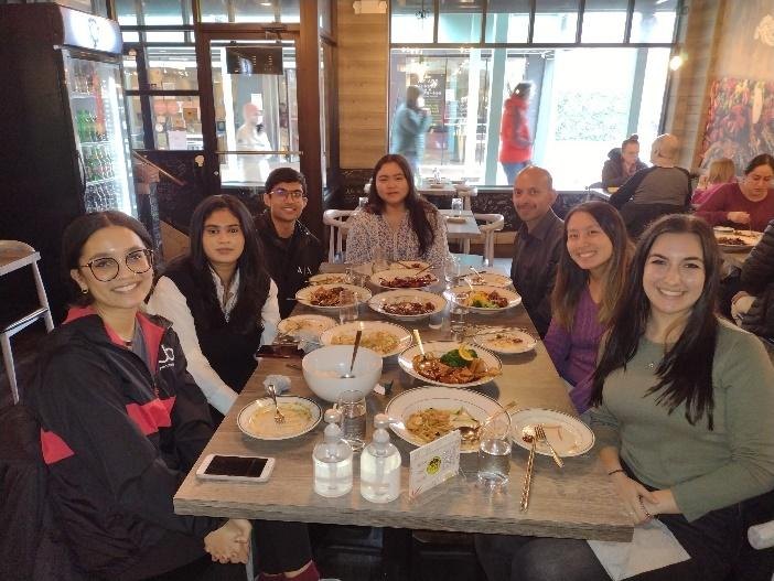 Lab members sharing a meal together